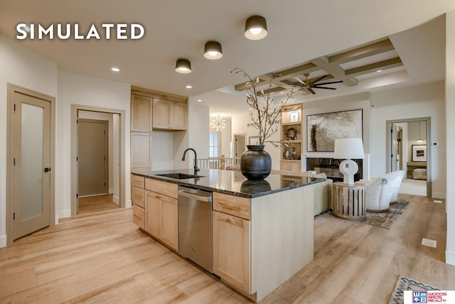 kitchen featuring sink, dishwasher, light wood-type flooring, and light brown cabinets