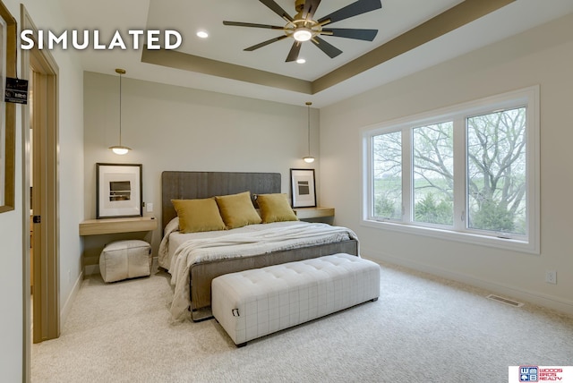 bedroom with ceiling fan and light carpet