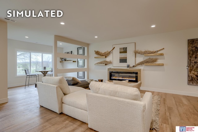 living room with light hardwood / wood-style flooring