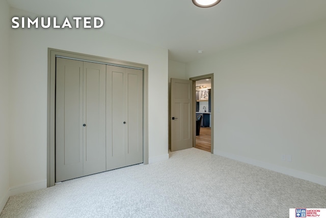 unfurnished bedroom featuring a closet and carpet floors