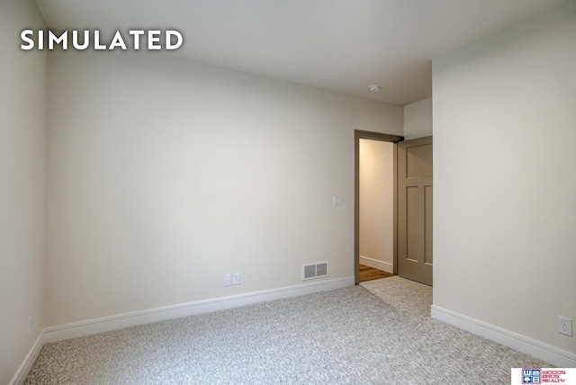 unfurnished room featuring carpet