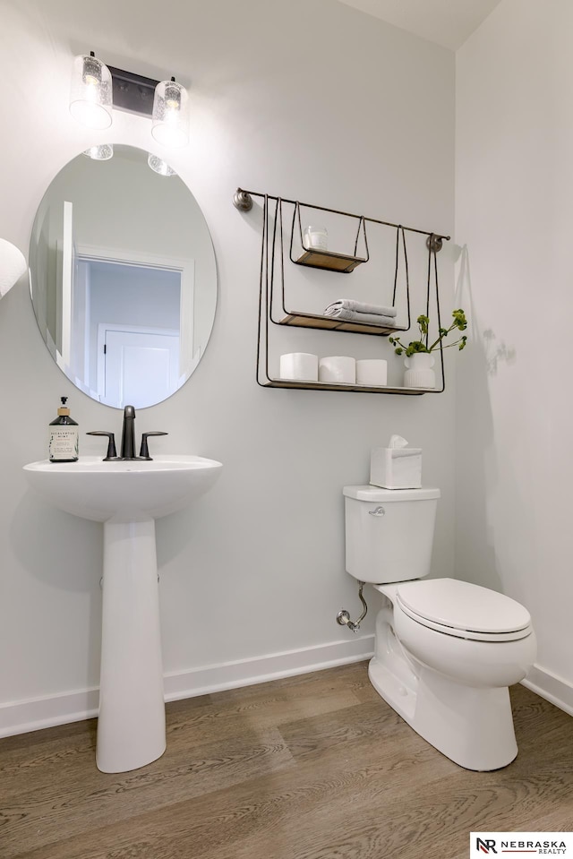 bathroom featuring toilet and hardwood / wood-style floors