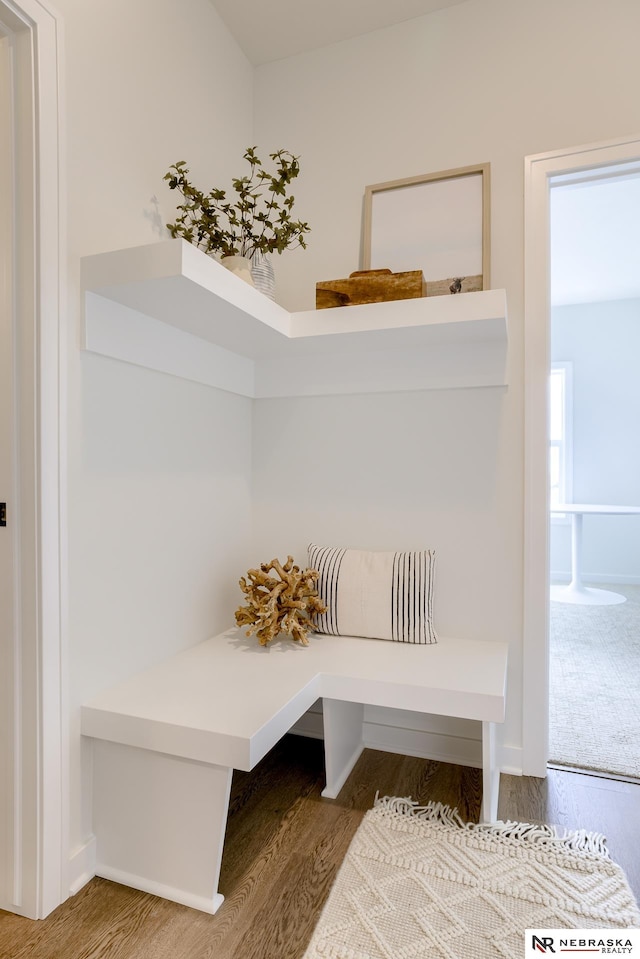 mudroom with wood-type flooring