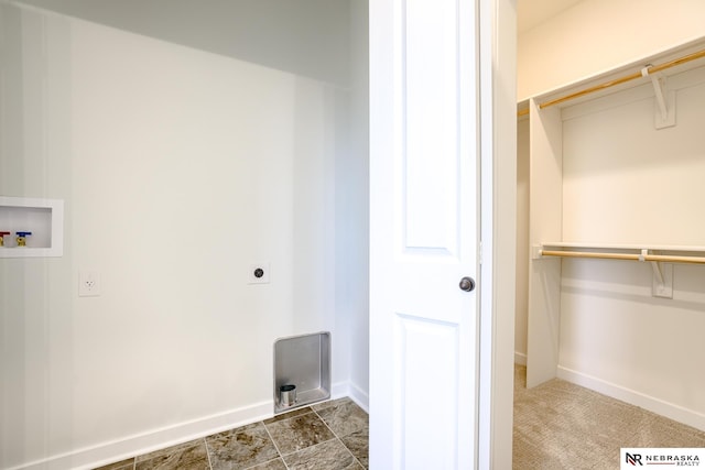 clothes washing area featuring washer hookup and hookup for an electric dryer