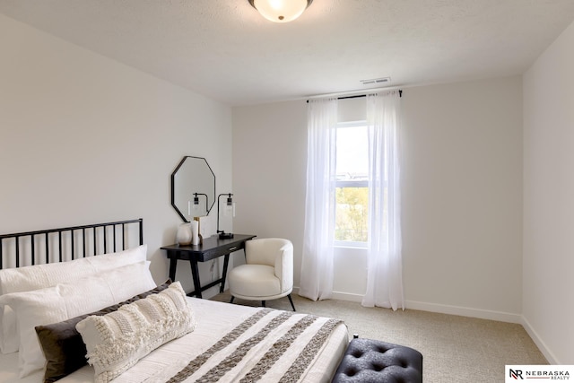 bedroom with light colored carpet