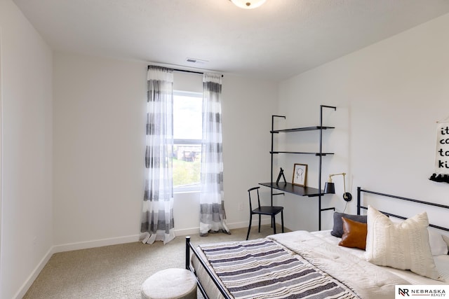 bedroom with light colored carpet