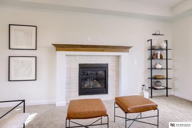 carpeted living room with a fireplace