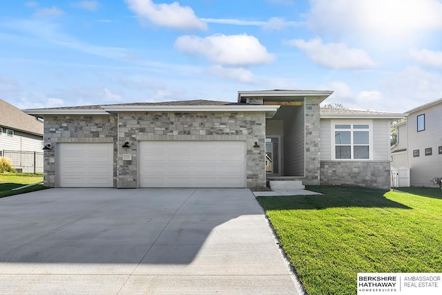 view of front of property with a front lawn and a garage