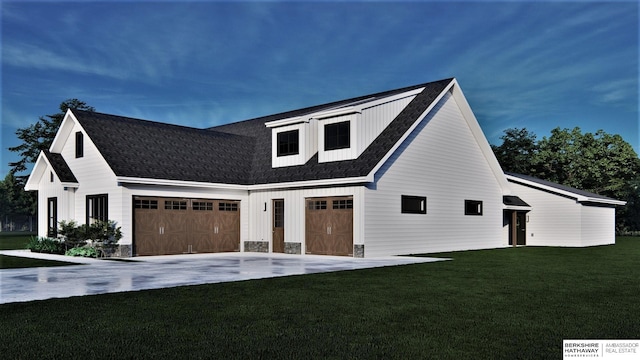 exterior space with a garage, concrete driveway, and a front yard