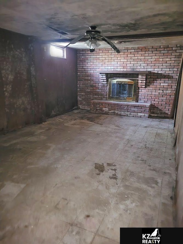 basement featuring brick wall and ceiling fan