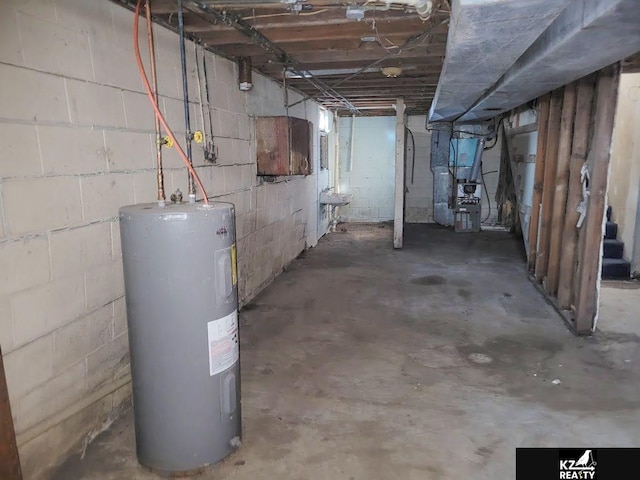 basement featuring heating unit, sink, and water heater