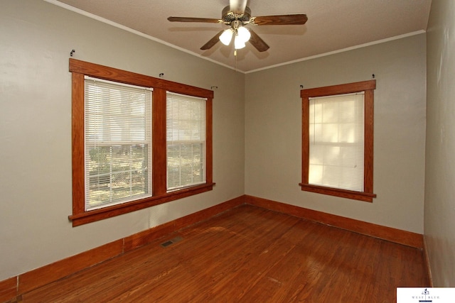 spare room with ornamental molding, hardwood / wood-style flooring, and ceiling fan