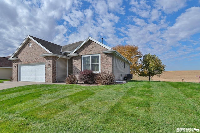 view of front of property with central air condition unit, a front lawn, and a garage