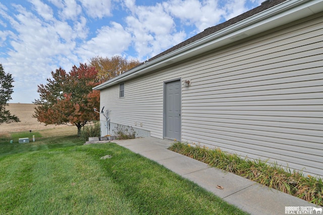 doorway to property featuring a yard