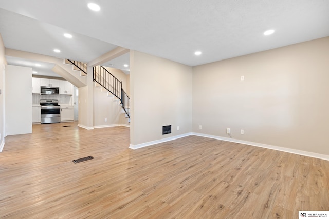 unfurnished living room featuring light hardwood / wood-style floors