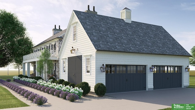 view of home's exterior featuring a garage and a balcony