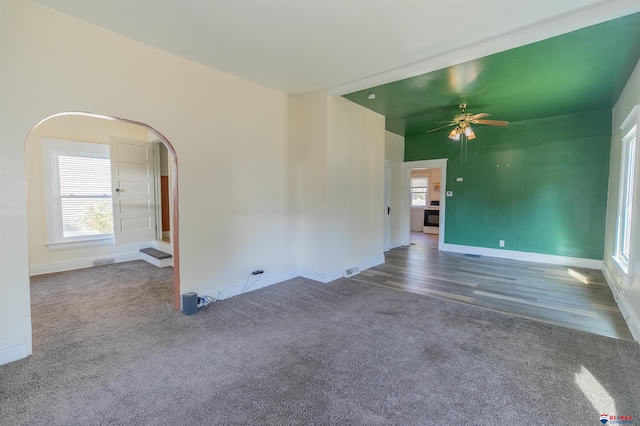 unfurnished room with hardwood / wood-style flooring and ceiling fan