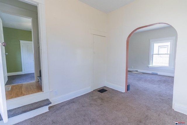 empty room featuring carpet floors