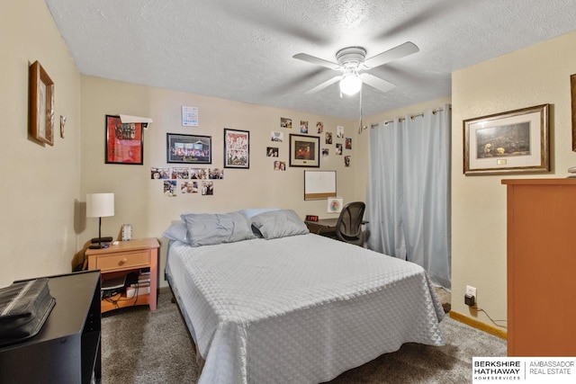 bedroom featuring dark carpet, a textured ceiling, and ceiling fan