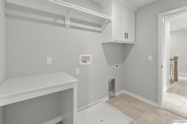 washroom featuring hookup for an electric dryer, baseboards, light carpet, hookup for a washing machine, and cabinet space