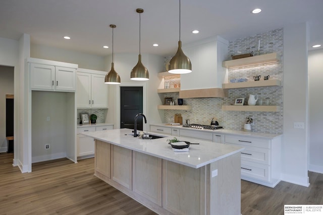 kitchen featuring light hardwood / wood-style floors, white cabinets, and sink