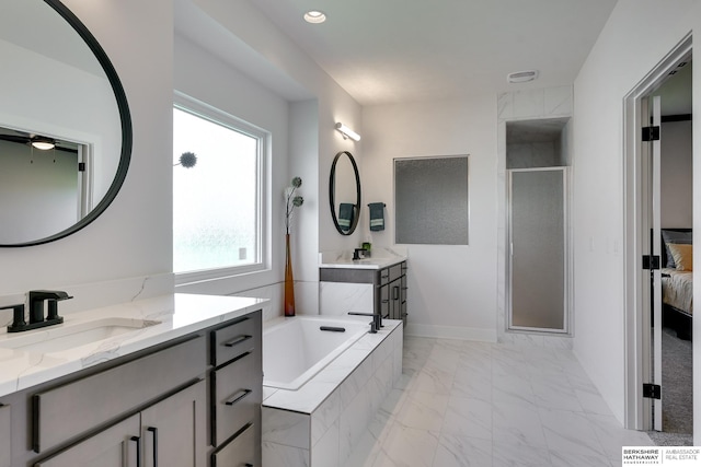 bathroom featuring vanity and plus walk in shower