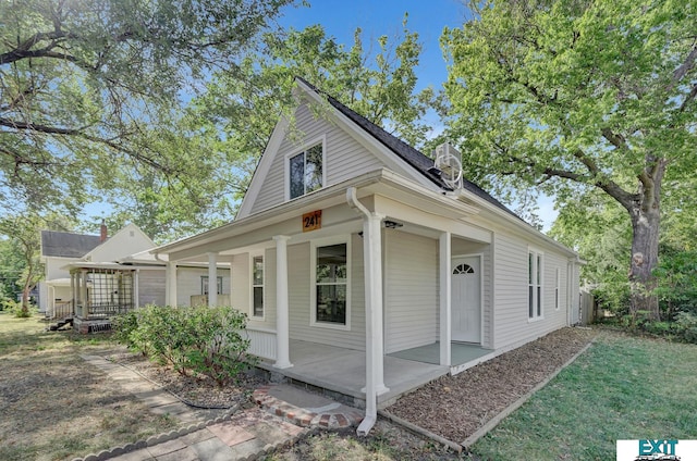 view of side of property with a porch