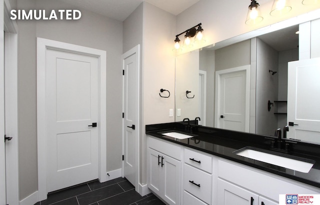 bathroom featuring tile patterned flooring and vanity