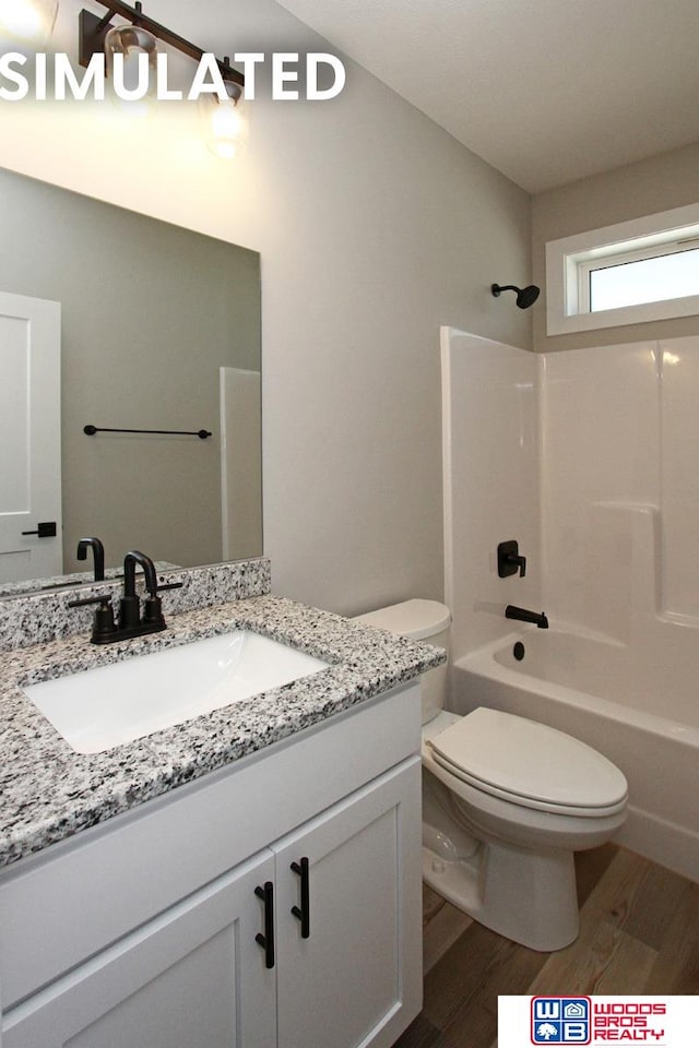 full bathroom featuring shower / bathing tub combination, vanity, toilet, and wood-type flooring