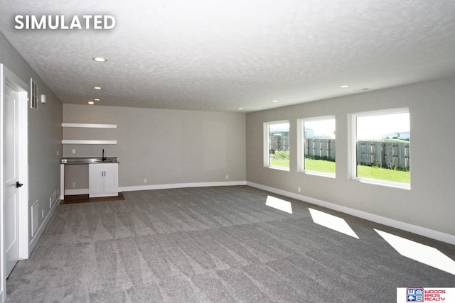 interior space with a textured ceiling