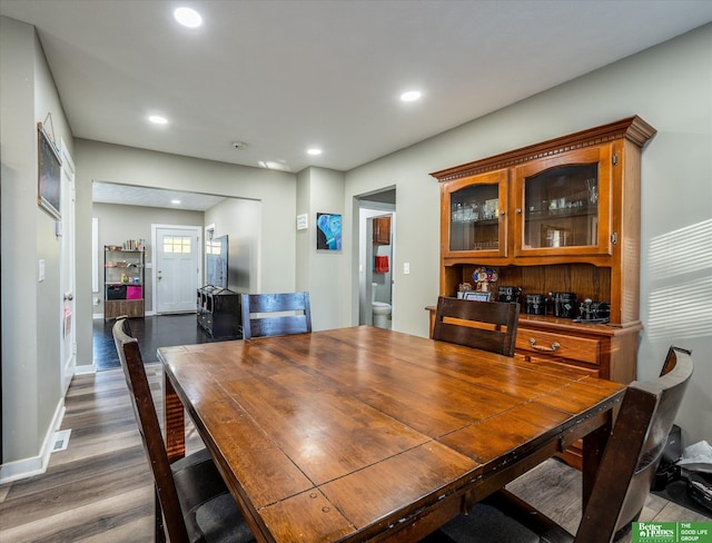 dining area featuring hardwood / wood-style floors