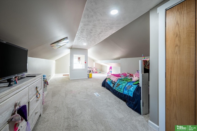 bedroom with light carpet and vaulted ceiling