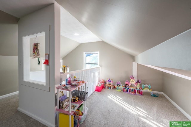 rec room featuring carpet and vaulted ceiling