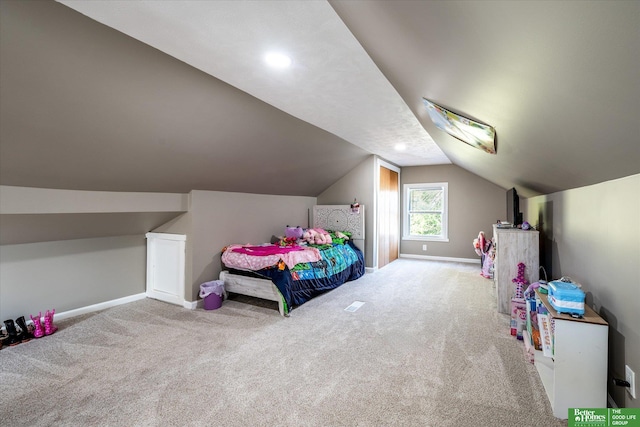 carpeted bedroom featuring vaulted ceiling