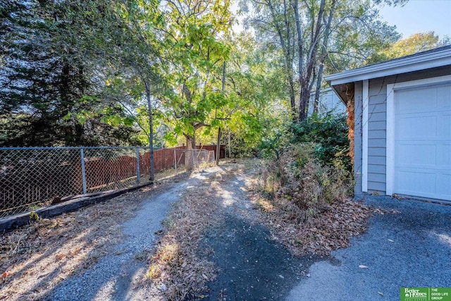 view of yard with a garage