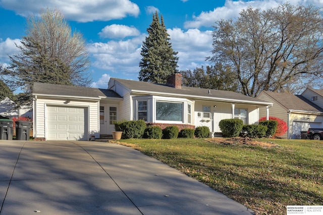 ranch-style home featuring a front yard and a garage