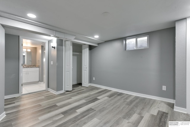 basement featuring light hardwood / wood-style flooring