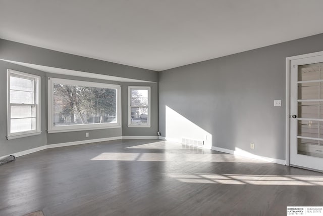 empty room featuring hardwood / wood-style floors