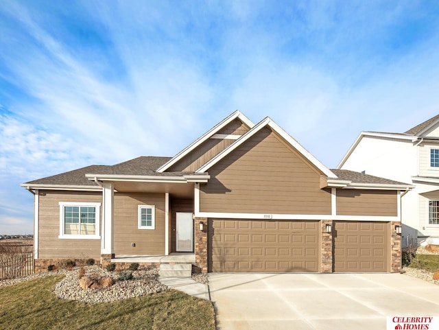 craftsman house with a garage