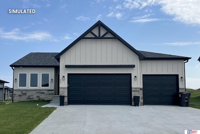 view of front of home with a garage and a front lawn