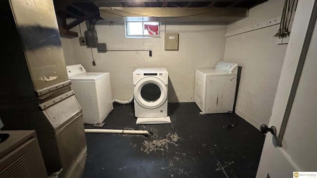 washroom featuring electric panel and washer and dryer