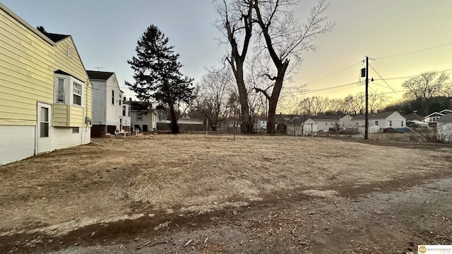 view of yard at dusk