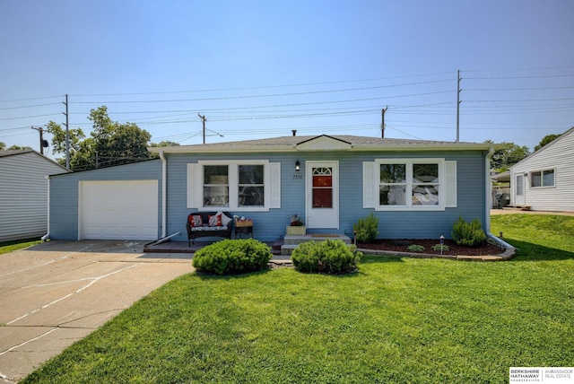 7336 S 71st Ave, Omaha, NE 68128 - view of front of property with a garage, concrete driveway, and a front lawn