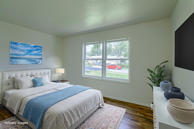 7336 S 71st Ave, Omaha, NE 68128 - bedroom with dark wood-style floors and baseboards