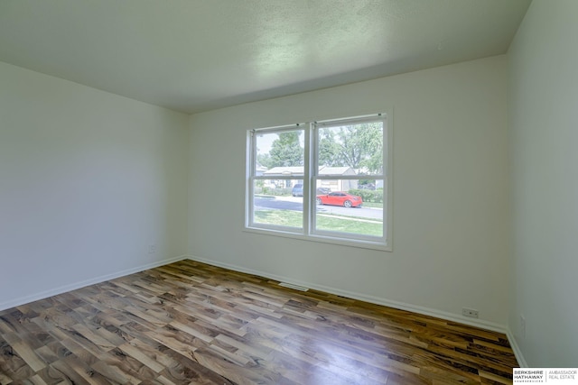 7336 S 71st Ave, Omaha, NE 68128 - empty room with wood finished floors and baseboards