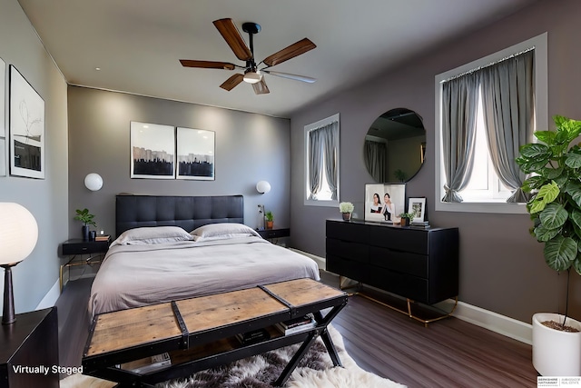 7336 S 71st Ave, Omaha, NE 68128 - bedroom featuring multiple windows, wood finished floors, and a ceiling fan