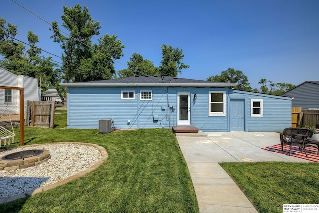 7336 S 71st Ave, Omaha, NE 68128 - back of property with an outdoor fire pit and a patio