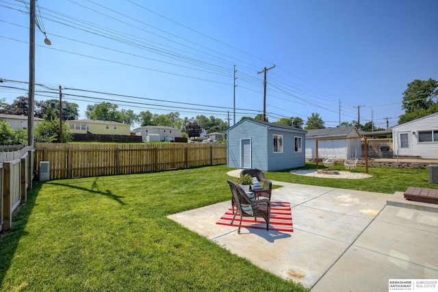 7336 S 71st Ave, Omaha, NE 68128 - fenced backyard featuring a patio area and an outdoor structure