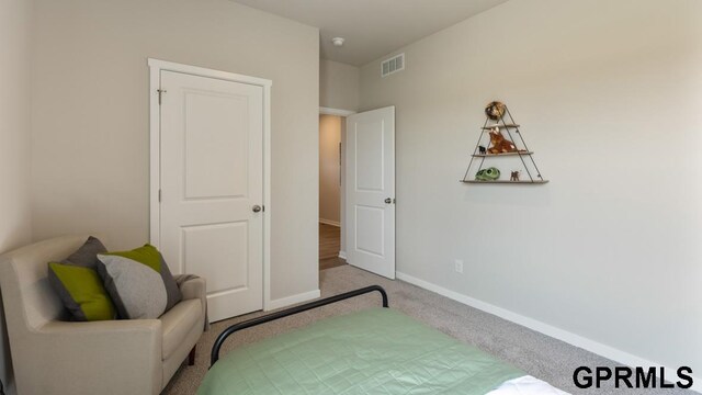 bedroom with light carpet