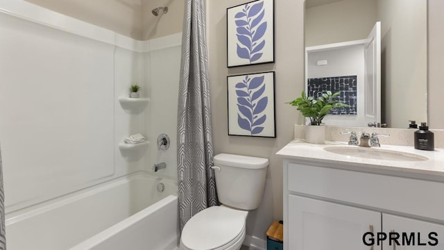 full bathroom with vanity, shower / tub combo with curtain, and toilet